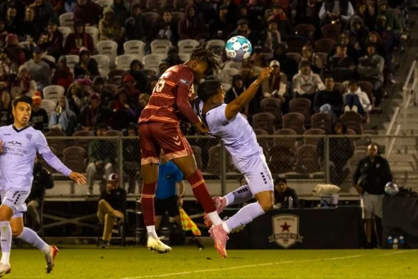 soccer player header duel
